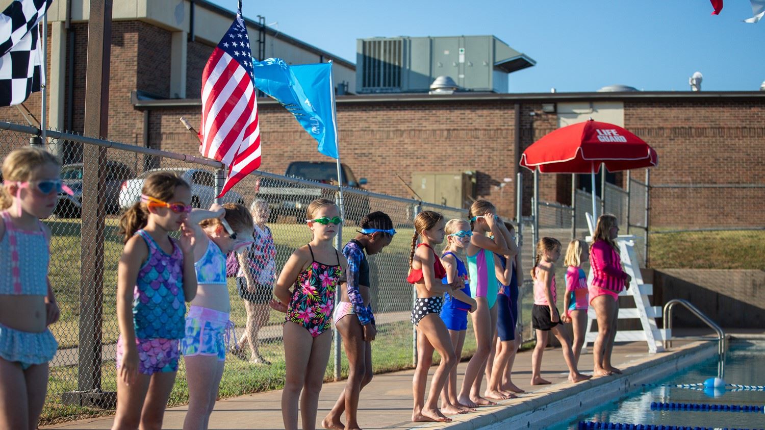 pool with little girls standing around it