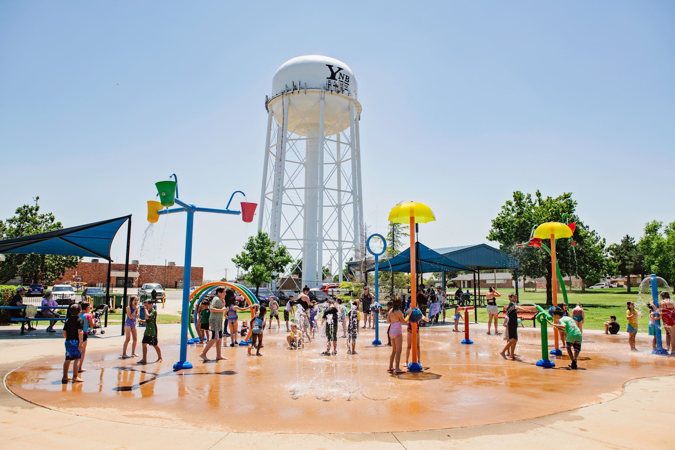 Splash pad with water gushing from the features