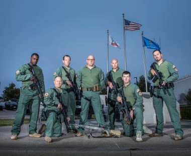 Group of People Holding Guns